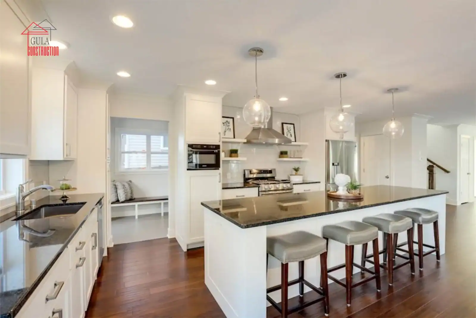Bright residential kitchen with a central island and white cabinetry
